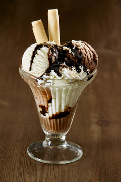 Delicious vanilla ice cream sundae with chocolate