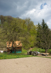 Tractor on Gield with Small farm House