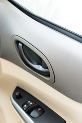 close-up knob of doors interior of modern car