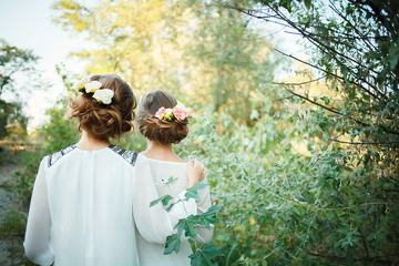 Beautiful bridesmaids with bouquets in their hairs