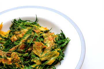 Cha-om Omelet in white plate(Acacia Pennata Omelet); Thai traditional food