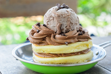 Waffle topped with chocolate ice cream