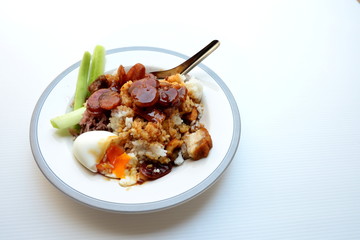 Rice with crispy pork, chinese sausage, soft boiled egg and red sauce