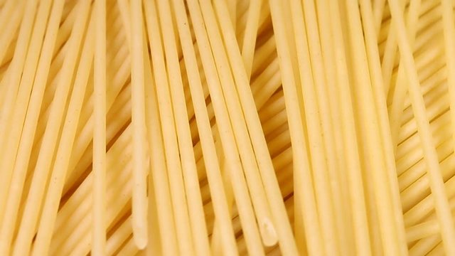 Italian spaghetti rotating in front of camera. Macro shot.