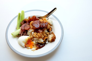 Rice with crispy pork, chinese sausage, soft boiled egg and red sauce