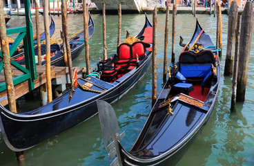 Fototapeta na wymiar venetian gondolas in canal of Venice