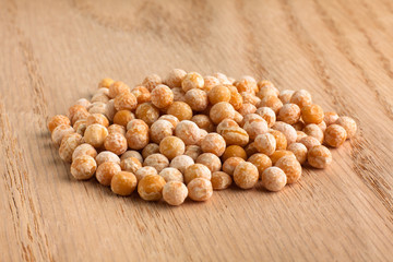 heap of dried peas on wooden background