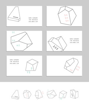 Collection of business cards with geometric outline shapes 