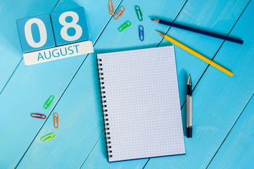August 8th. Image of august 8 wooden color calendar on blue background. Summer day. Empty space for...