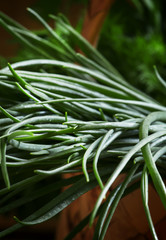 Obraz premium Green onions, vintage wooden background, selective focus, shallo