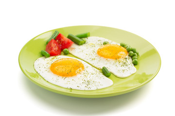 fried egg in plate isolated on white