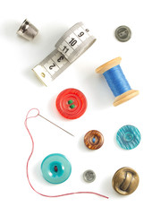 sewing tools and accessories on white