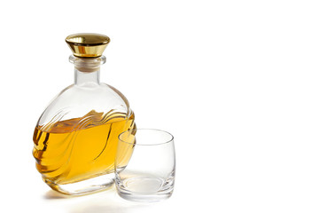 Bottle whiskey and glass on white background