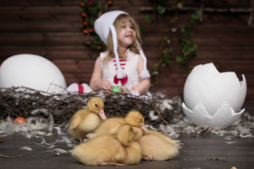 little girl with ducklings
