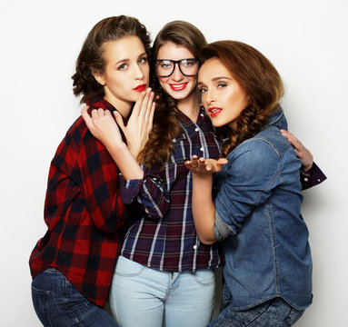 Fashion portrait of three stylish sexy girls best friends