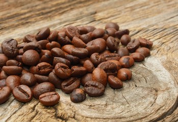 Coffee beans on wood background
