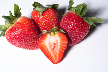 fresh tasty, ripe strawberries with green leafs