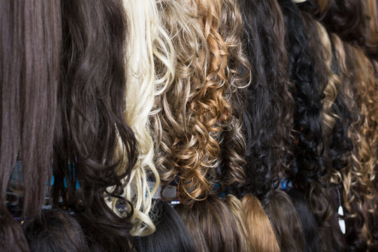 Clip-in hair extensions in wig shop .
