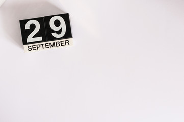 September 29th. Image of september 29 wooden office calendar on white background. Autumn day. Empty space for text