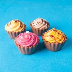 Birthday cupcakes on blue background. many sweet  cupcakes