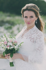 Amazing Happy young woman in wedding dress