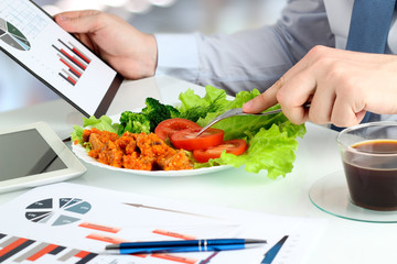 Close-up of businessman working on marketing strategy during bus