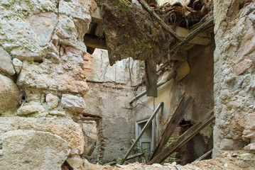 Dilapidated house, rubble and debris