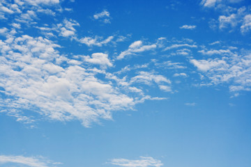 Naklejka na ściany i meble Bright sunny day with clouds. Cloudscape on blue sky.