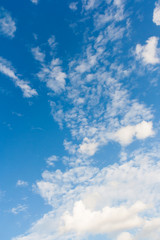 Bright sunny day with clouds. Cloudscape on blue sky.