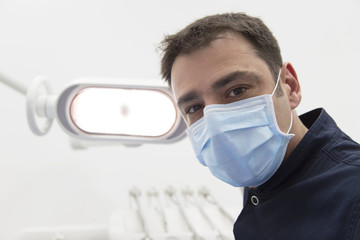 Fototapeta na wymiar Low angle view of male dentist ready for dental examination