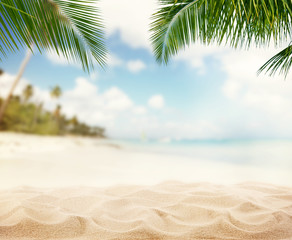 Fototapeta Summer sandy beach with blur ocean on background obraz