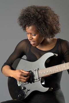 black girl, black angel with electric guitar