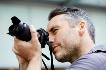 Male photographer taking picture