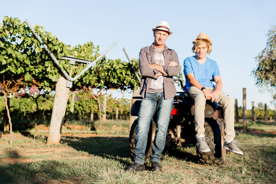 Father and son in vineyard