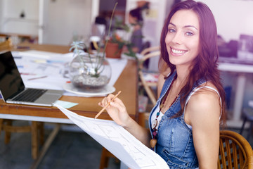 Young woman standing in creative office