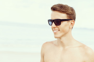 Handsome man posing at beach