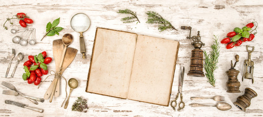 Vintage cookbook, vegetables and herbs. Flat lay