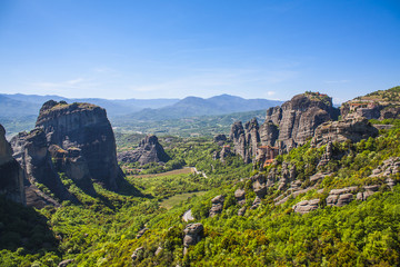 Meteora, Greece. Mountain scenery with Meteora rocks, landscape place of monasteries on the rock, orthodox religious greek landmark in Thessaly. Beautiful  landscape in summer day.
