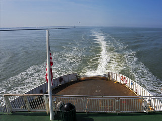 Prop wash from a car ferry traveling across open water