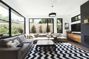 Black and white scheme living room with wood and grey tiling acc