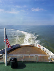 Prop wash from a car ferry traveling across open water