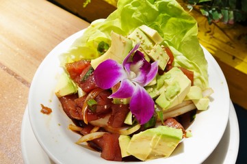 Hawaiian ahi tuna poke with salad and avocado