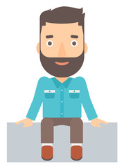 Smiling man sitting.