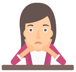 Woman clutching her head in desperate.