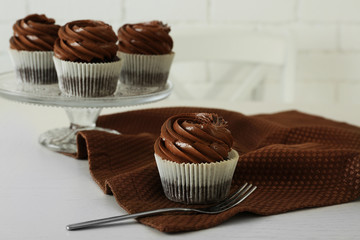 Chocolate cupcakes with fork on light table