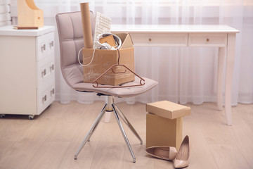 Cardboard boxes with things for relocation in room interior
