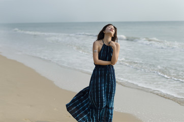 Lady wandering on the beach
