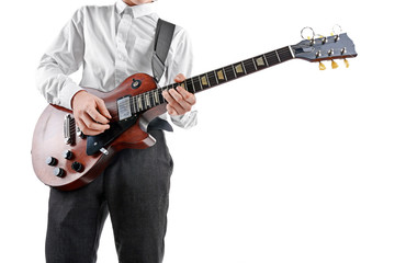 Young man playing electric guitar on white background