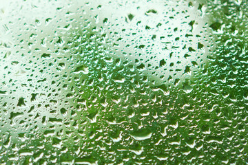 water flow down the glass after rain