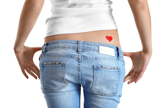 Drawing red heart on female back isolated on white
